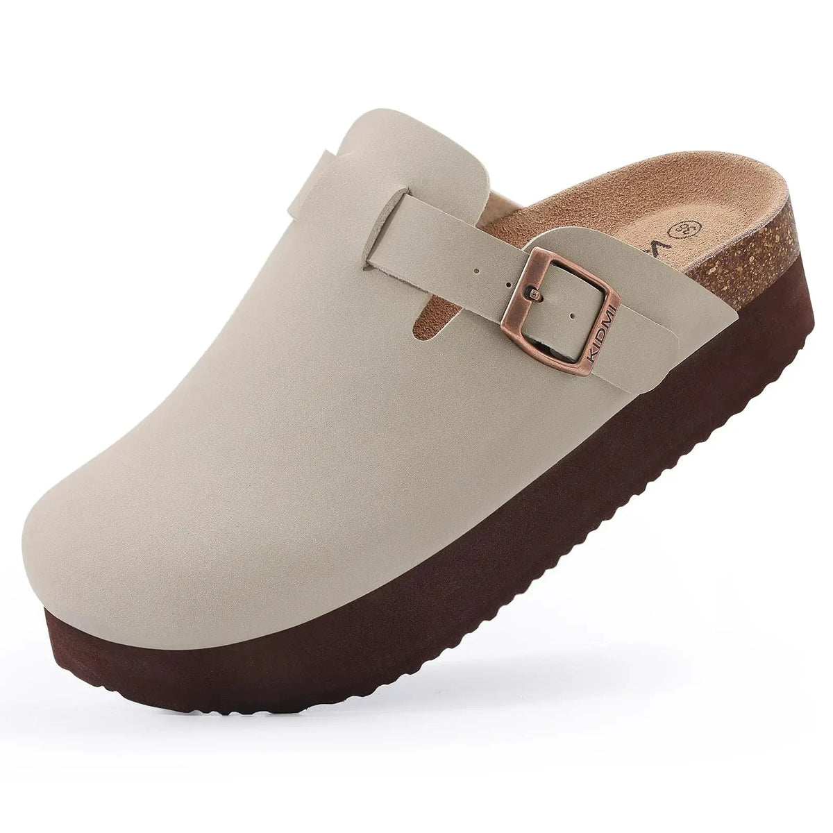 A beige suede cork mule with a brown sole and a leather strap detail.