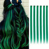 A set of six green clip-in hair extensions being styled into a braid on dark hair.