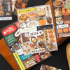 A set of decorative cut film stickers for DIY scrapbooking and journaling displayed on a wooden surface.