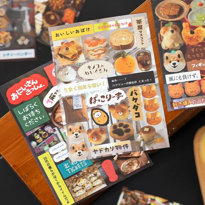 A set of decorative cut film stickers for DIY scrapbooking and journaling displayed on a wooden surface.