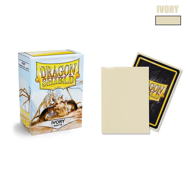 A box of Dragon Shield Ivory matte card sleeves with a black card sleeve displayed next to it.