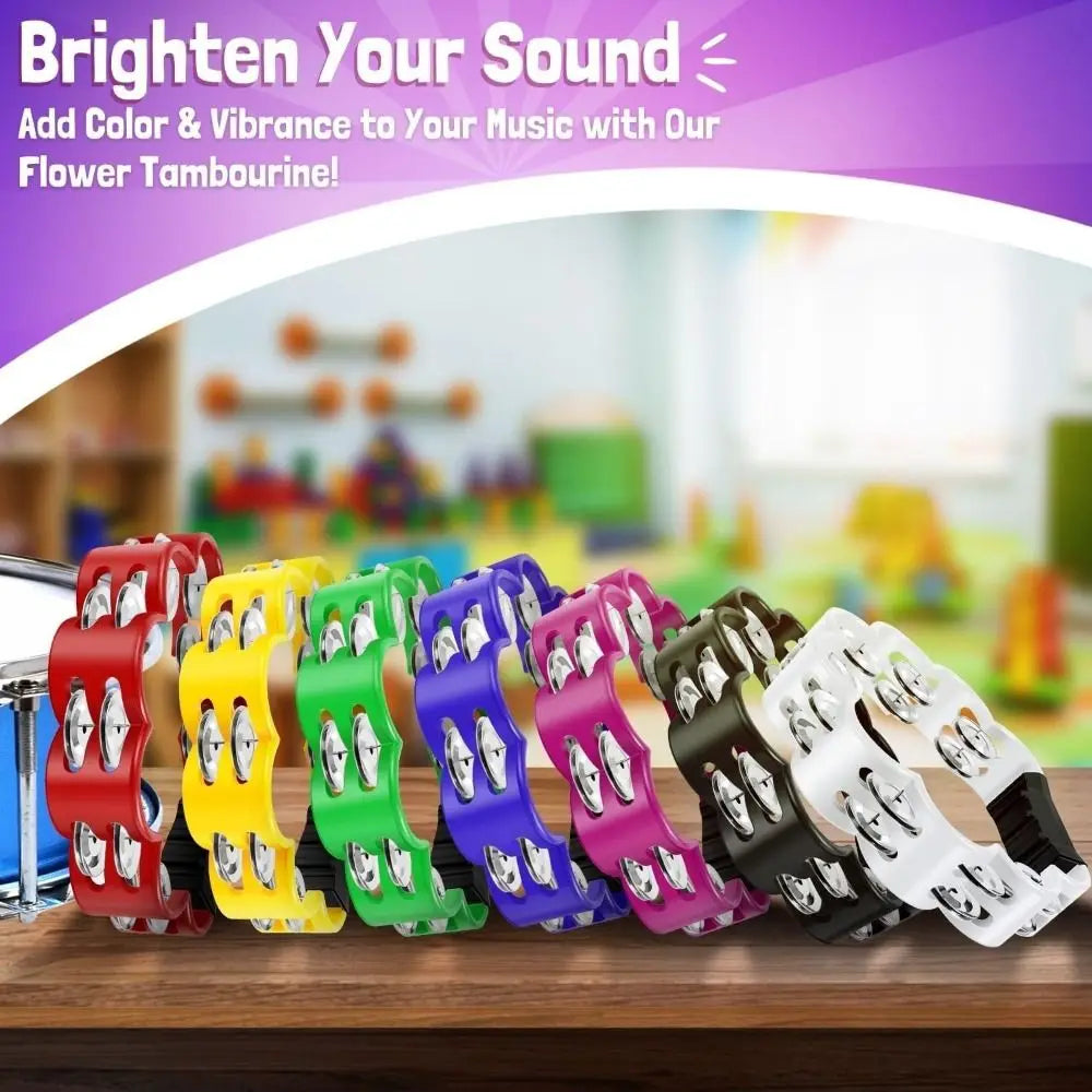 A variety of petal-shaped hand-cranked tambourines in multiple colors are displayed on a wooden surface.