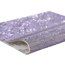 Roll of purple sparkling rhinestone adhesive tape for DIY crafts and decor