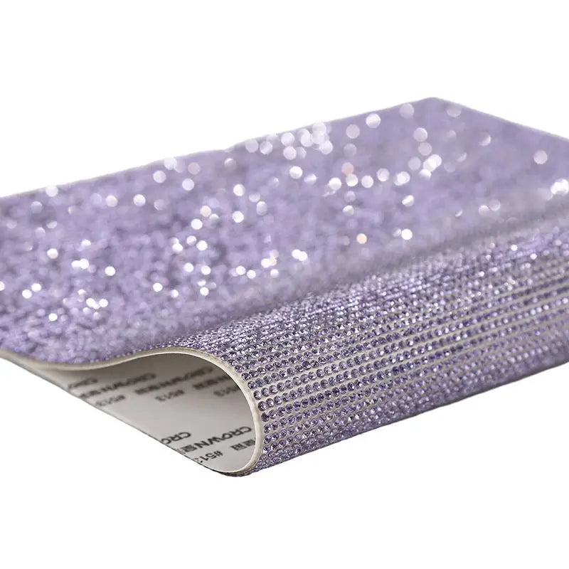 Roll of purple sparkling rhinestone adhesive tape for DIY crafts and decor