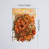 A sheet of transparent floral stickers featuring orange and yellow flowers and greenery for journals and crafts.
