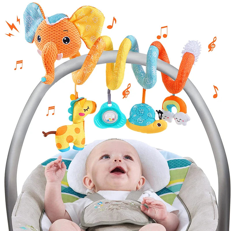 A baby is looking up at a colorful spiral sensory rattle toy with various animal shapes and musical notes.