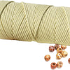 A spool of natural beige cotton macrame rope for crafts and decor