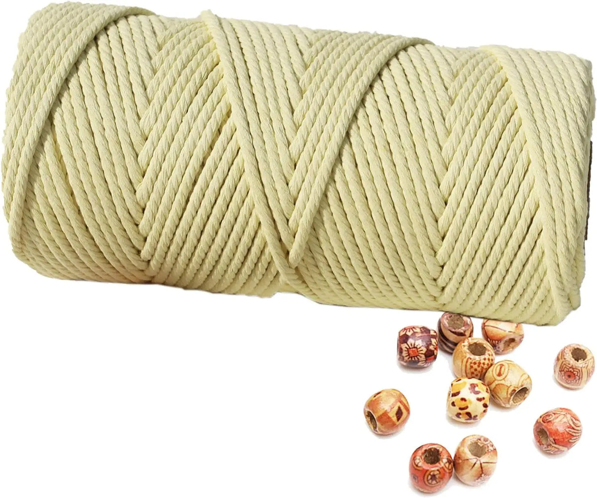 A spool of natural beige cotton macrame rope for crafts and decor