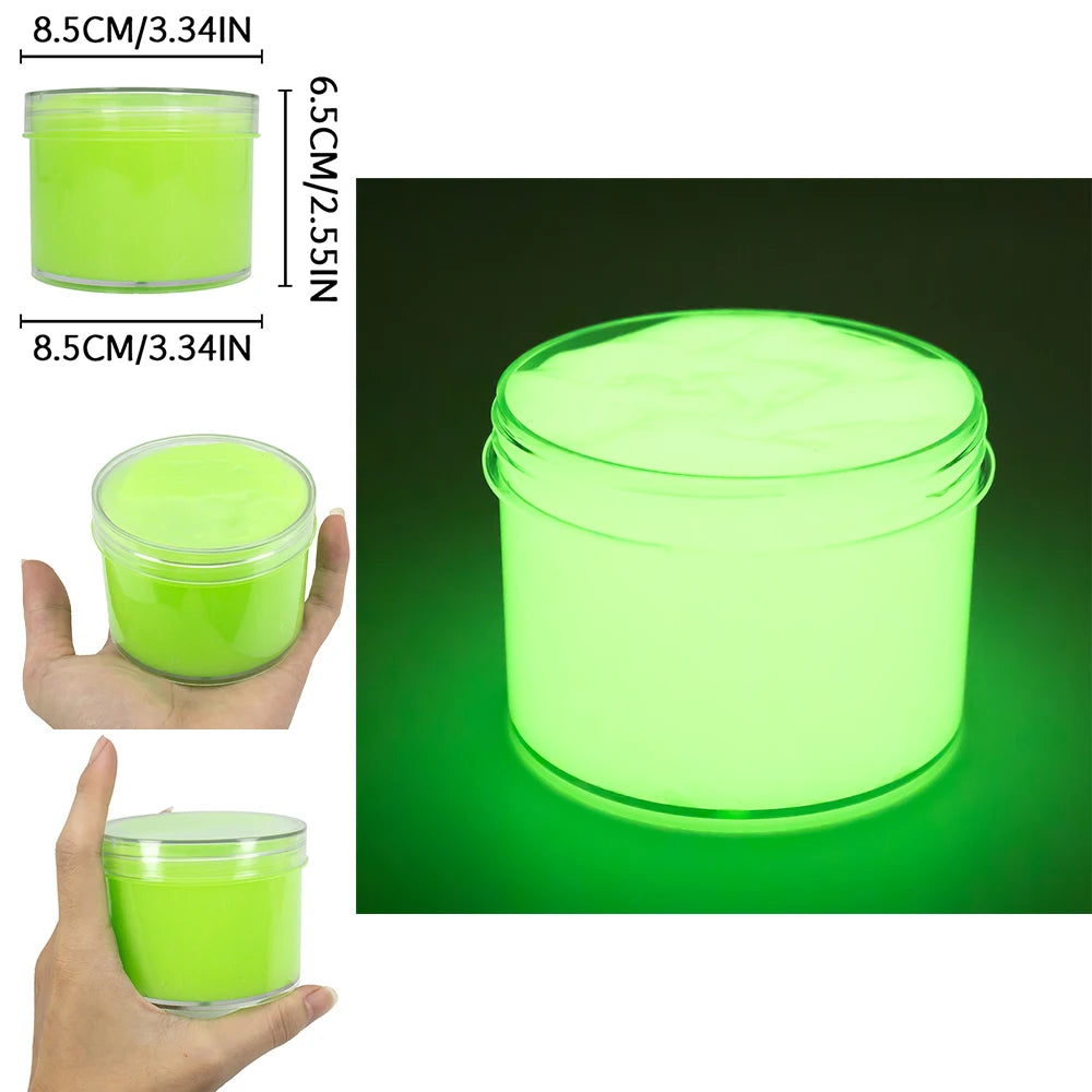 A clear jar of glow-in-the-dark crystal slime with neon green contents, shown next to a hand and a measurement guide.