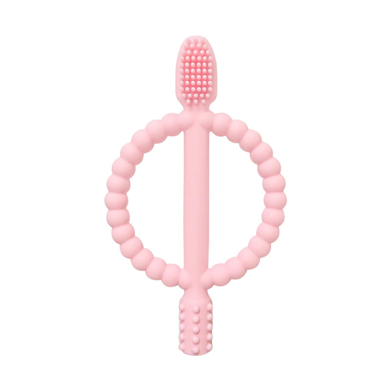 A pink silicone baby teether with easy-grip handles shaped like a ring and a cross.