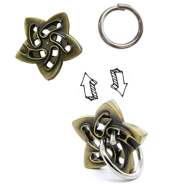A brass metal brain teaser puzzle featuring a floral design and a separate circular ring.