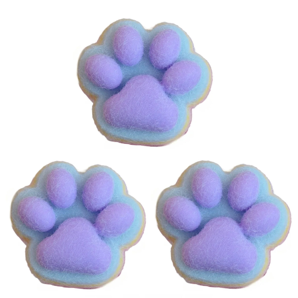 A soft purple and blue mochi squishy fidget toy shaped like a cat paw print.