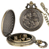 A brass steampunk dragon pocket watch dice case with an open lid and a separate decorative top.