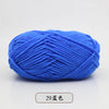 A ball of bright blue pre-dyed milk cotton yarn used for knitting and crochet.