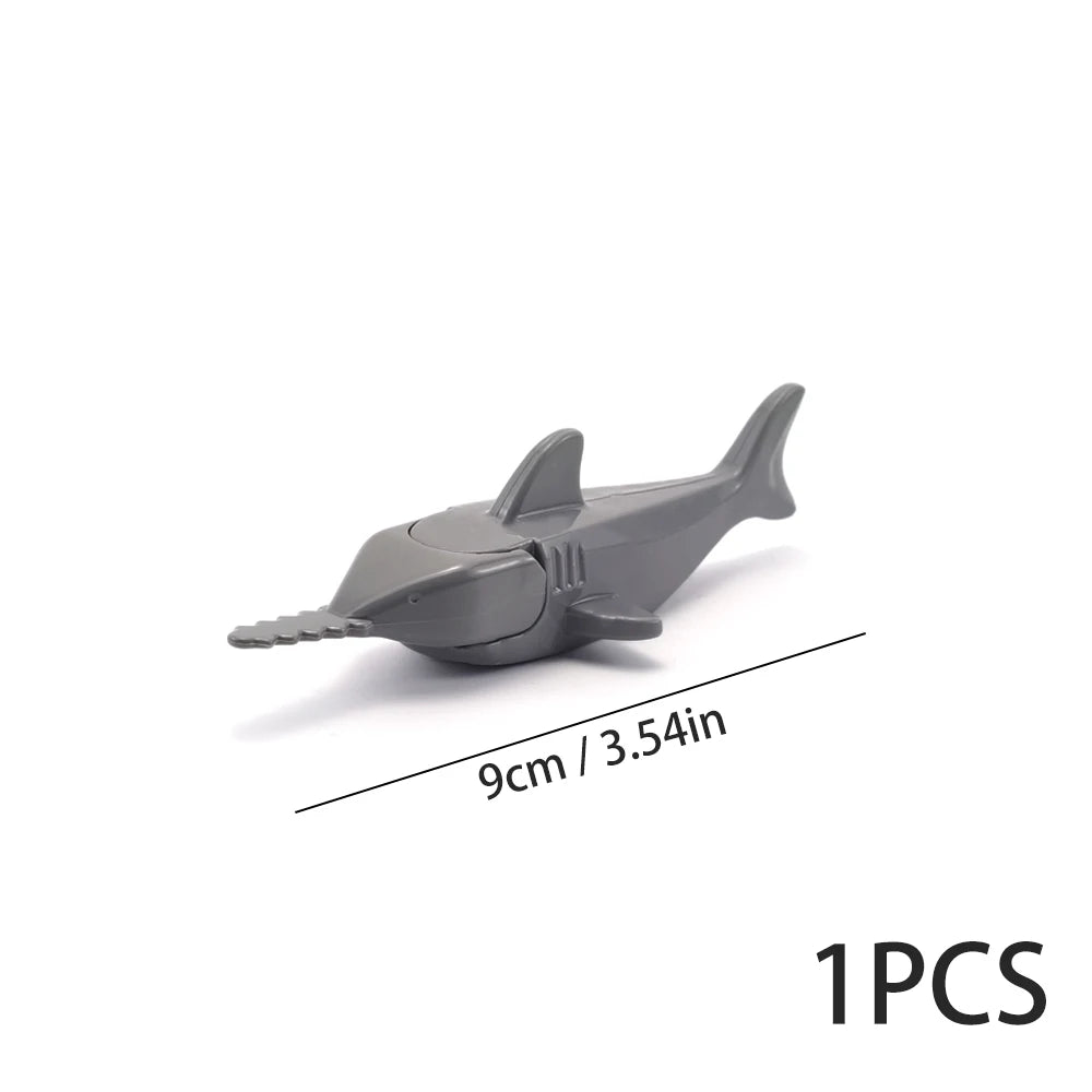 A gray plastic model of a marine creature used as an ocean animal building block.