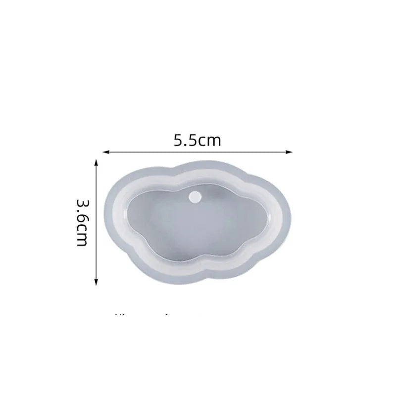 A light gray heart-shaped silicone mold for resin jewelry making, shown with dimensions 5.5cm by 3.6cm.