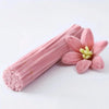 A bundle of pink chenille craft pipe cleaners with a light pink hue.