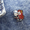 Enamel pin set featuring a boy and girl character from Gravity Falls wearing baseball caps and jackets