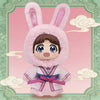 A plush blind box of a rabbit-eared girl in pink attire against a light green background with clouds.