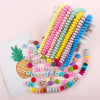 A collection of colorful silicone lentil beads shaped like abacus beads in various shades of pink, yellow, and blue.