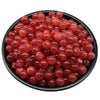 A pile of translucent reddish-pink acrylic round beads for jewelry making.
