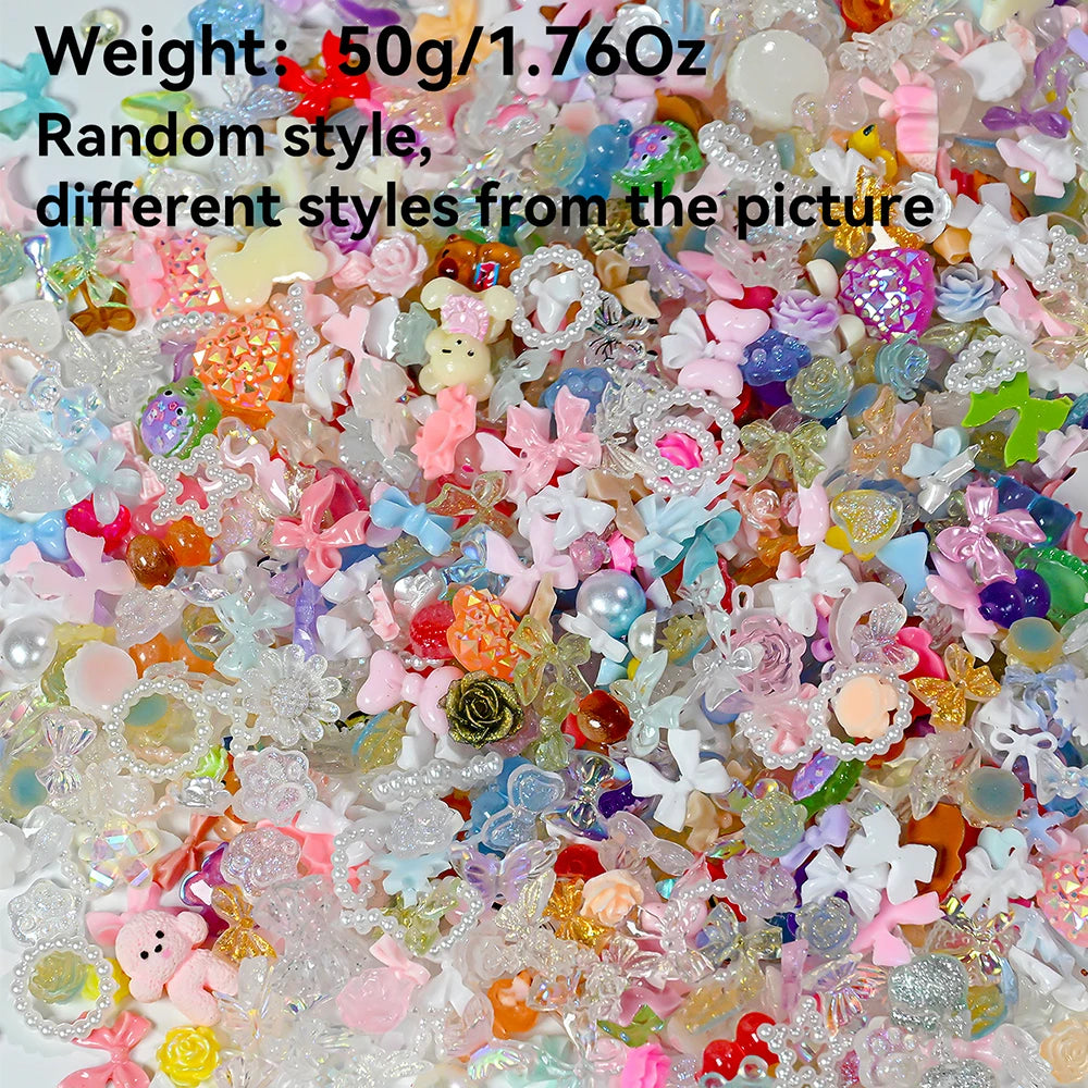 A close-up view of a mix of multicolor resin nail charms, including various shapes and glitter.
