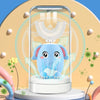 A blue elephant shaped electric toothbrush is shown inside a clear device with surrounding light effects.