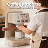 A child is playing with a coffee machine pretend-play set, demonstrating its use.