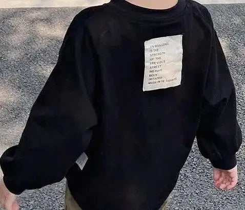 Black long sleeve cotton tee with white text on the chest