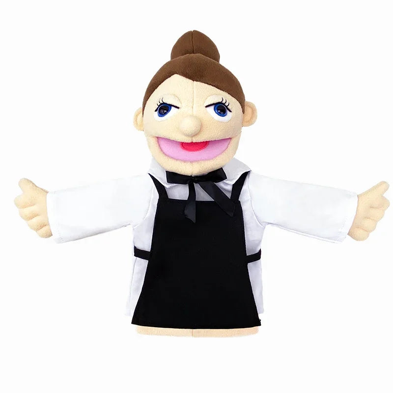 A plush hand puppet of a woman with brown hair, blue eyes, and a pink smile wearing a black apron over a white shirt.