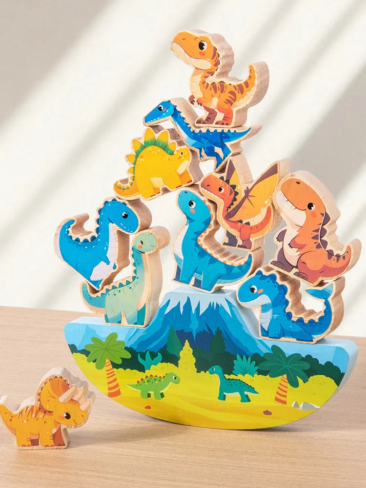 A stack of wooden dinosaur blocks in various colors and sizes, used as a Montessori balance toy for children.