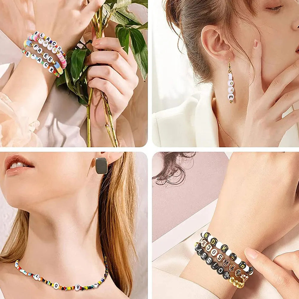 Close-up of various acrylic alphabet and number beads used for jewelry making on fingers and a necklace.