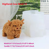 A brown silicone mold shaped like a Highland cow is shown next to a white candle, used for making crafts.