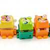 A row of colorful LED mechanical switch fidget keychains in various colors and designs.