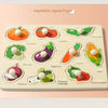A wooden jigsaw puzzle board featuring various vegetables like pumpkin, tomato, cucumber, and corn for children's learning.
