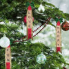 Christmas tree decorated with wooden alphabet letter tiles spelling LOVE, FUN, and HAPPY