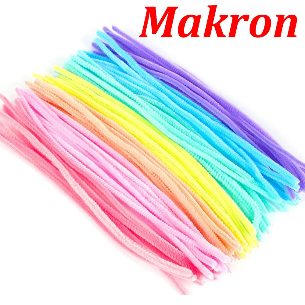 A bundle of colorful chenille stem pipe cleaners in a rainbow gradient arrangement.