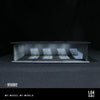 A 1:64 scale LED light-up underground garage diorama featuring a detailed model of a car display.