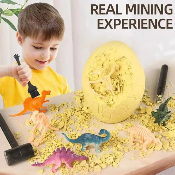 A child is excavating dinosaur fossils from yellow powder in a kit on a wooden surface.