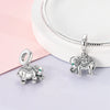 Sterling silver elephant charm beads displayed on a white background with a pink cloth.