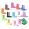 A collection of colorful acrylic letter beads in various shades including pink, orange, blue, and green.