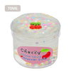 A clear jar of cherry-flavored slime putty with small red cherry decorations.