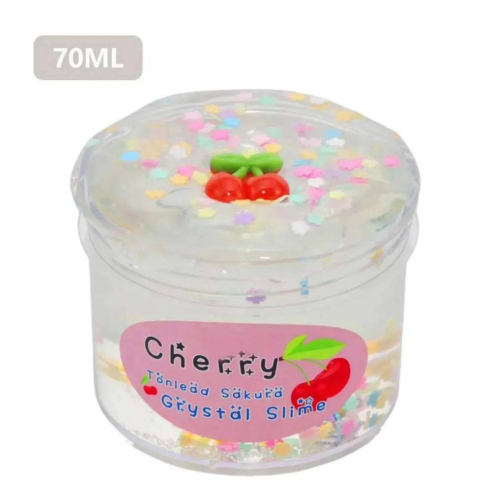 A clear jar of cherry-flavored slime putty with small red cherry decorations.