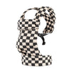 A black and white checkered adjustable cotton baby carrier wrap for newborns and toddlers.