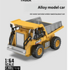 A yellow alloy dump truck model car is shown, ready for remote transmission control.