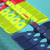 A set of flexible anti-gravity race car tracks in red, yellow, and blue plastic.