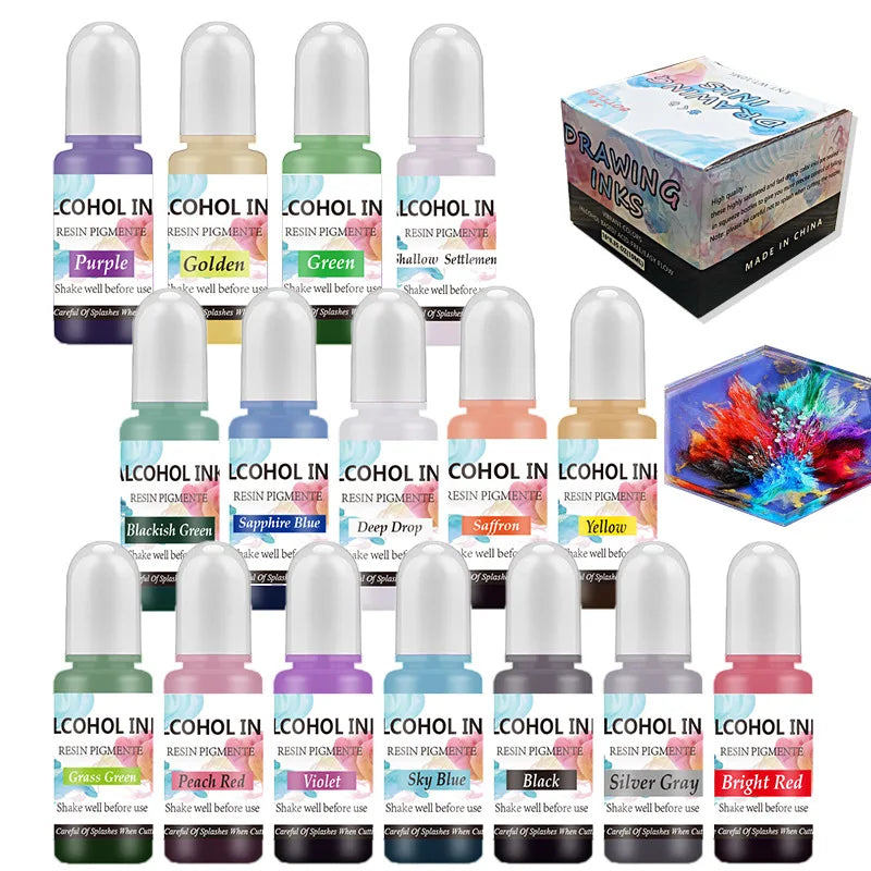 A collection of various colored resin pigment inks in glass vials and a box labeled Drawing Inks for crafts.
