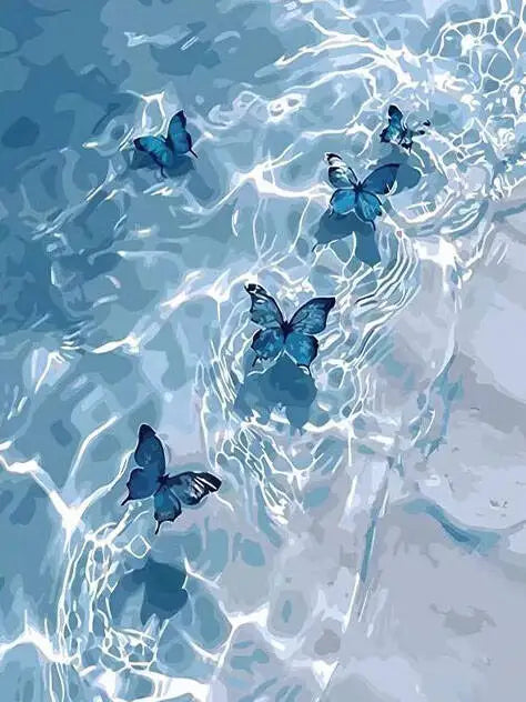 Blue butterflies swimming in clear water, creating a watercolor effect.