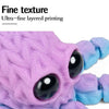 Close-up of a purple 3D printed articulated octopus featuring fine textured layered printing and black eyes.