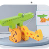 A set of wooden animal stacking blocks in green and orange colors with shape matching cards.